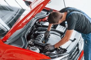 Mechanic Inspecting Car Engine