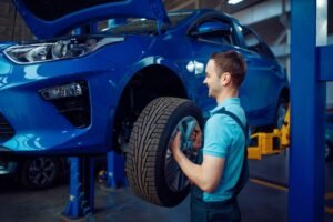 Mechanic Removing Car Wheel